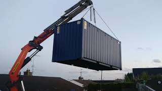 Crane operator lifts Shipping container over house [upl. by Ines]