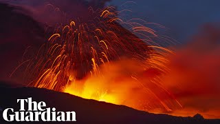 Mount Etna lights Sicilys night sky with red hot lava [upl. by Anirret]